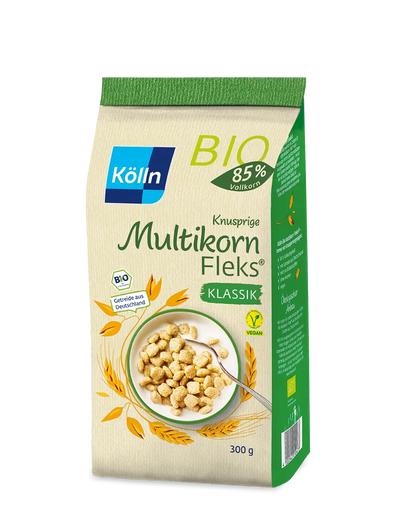 Die grün-beige Verpackung des Kölln Knusprige Multikorn Fleks von koelln enthält Bio-Getreide mit 85 % Vollkornanteil, wiegt 300 g und zeigt ein Müsli in einer Schale. Dieses vegane Produkt wird aus Getreide aus Deutschland hergestellt.